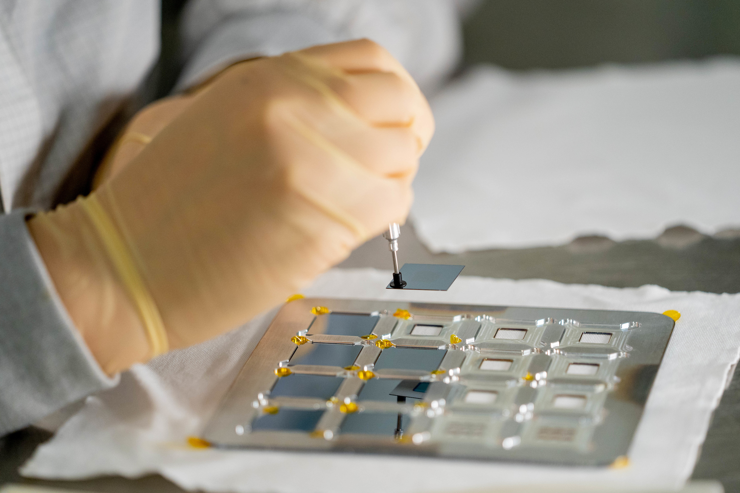 Researcher Maria Garcia works in a lab at MacroTechnology Works research facility